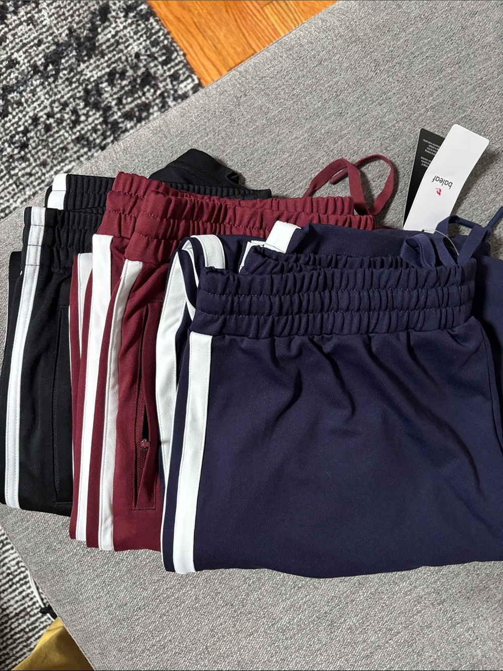 Baleaf Straight-Leg Track Pants in Navy, Maroon, Black with White Side Stripes.